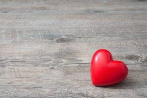 Red Heart On Wooden Background