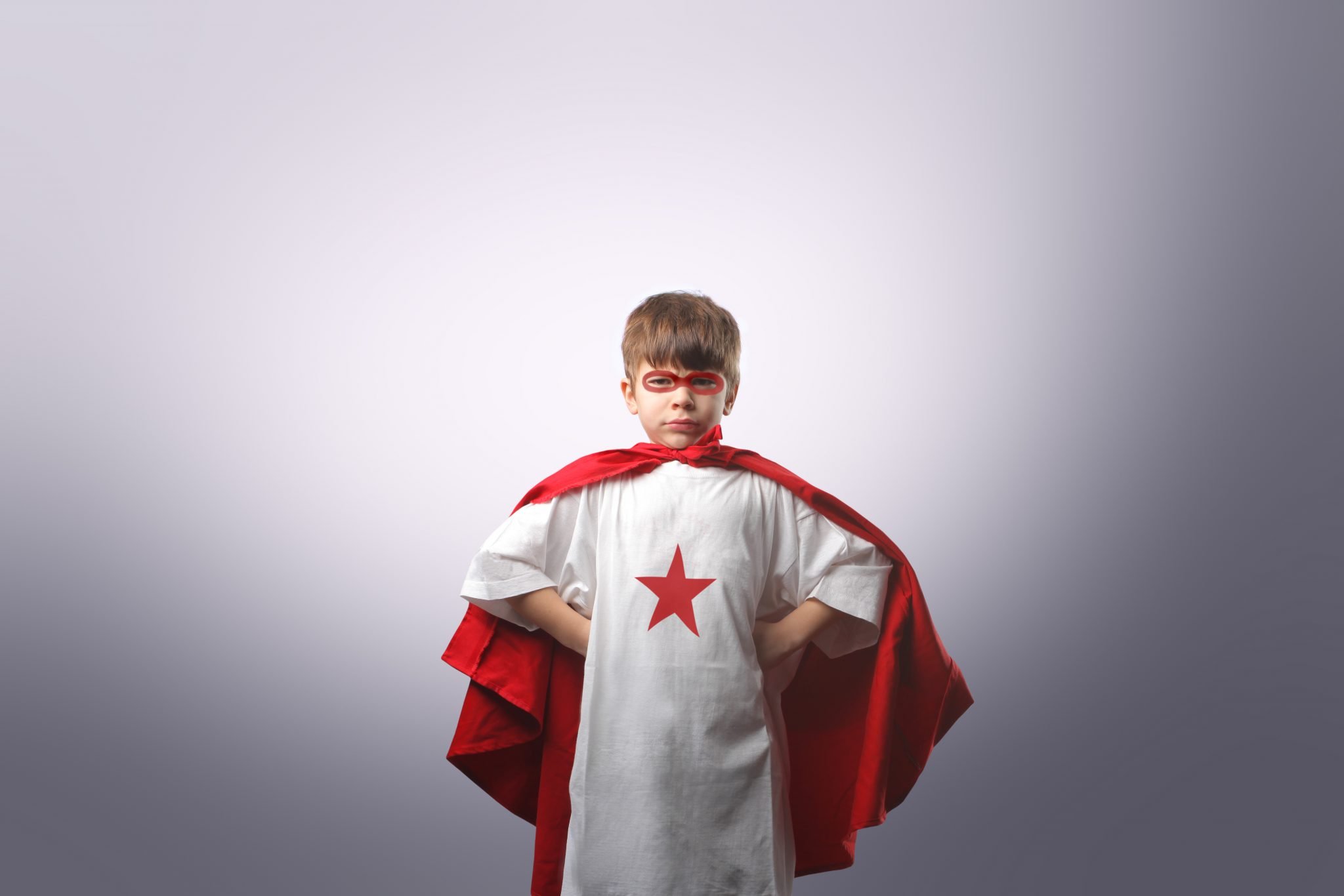 child dressed as superhero