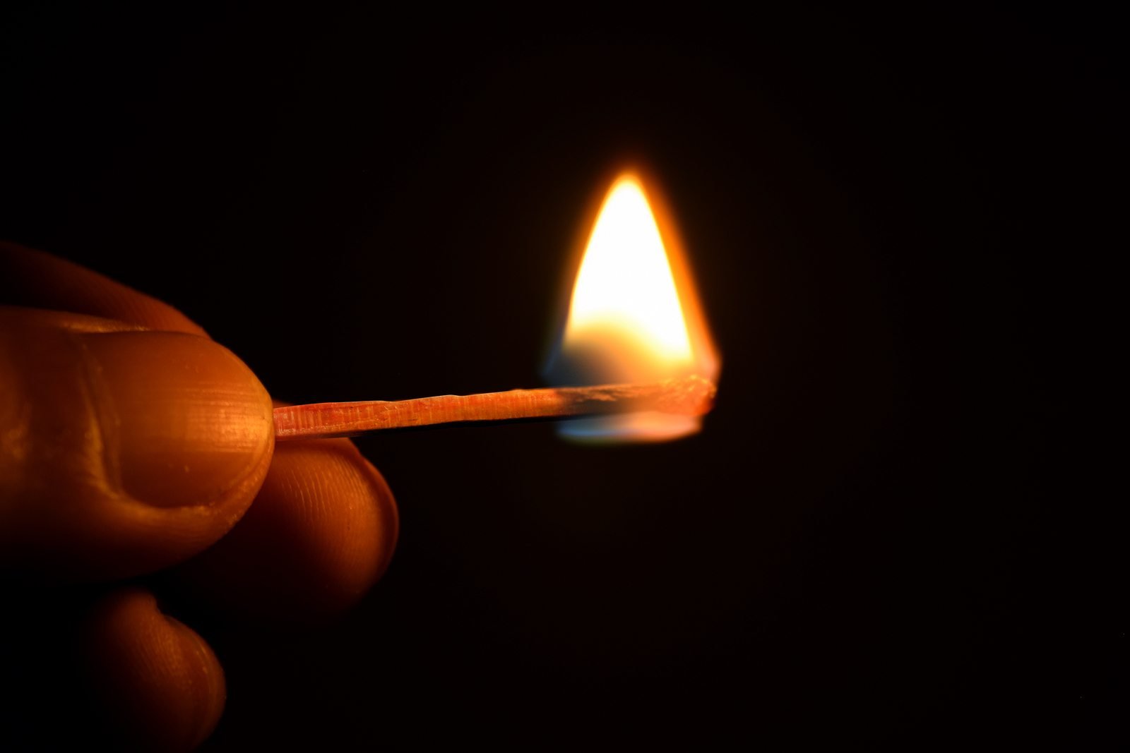 hold are ignited matches isolate on black background